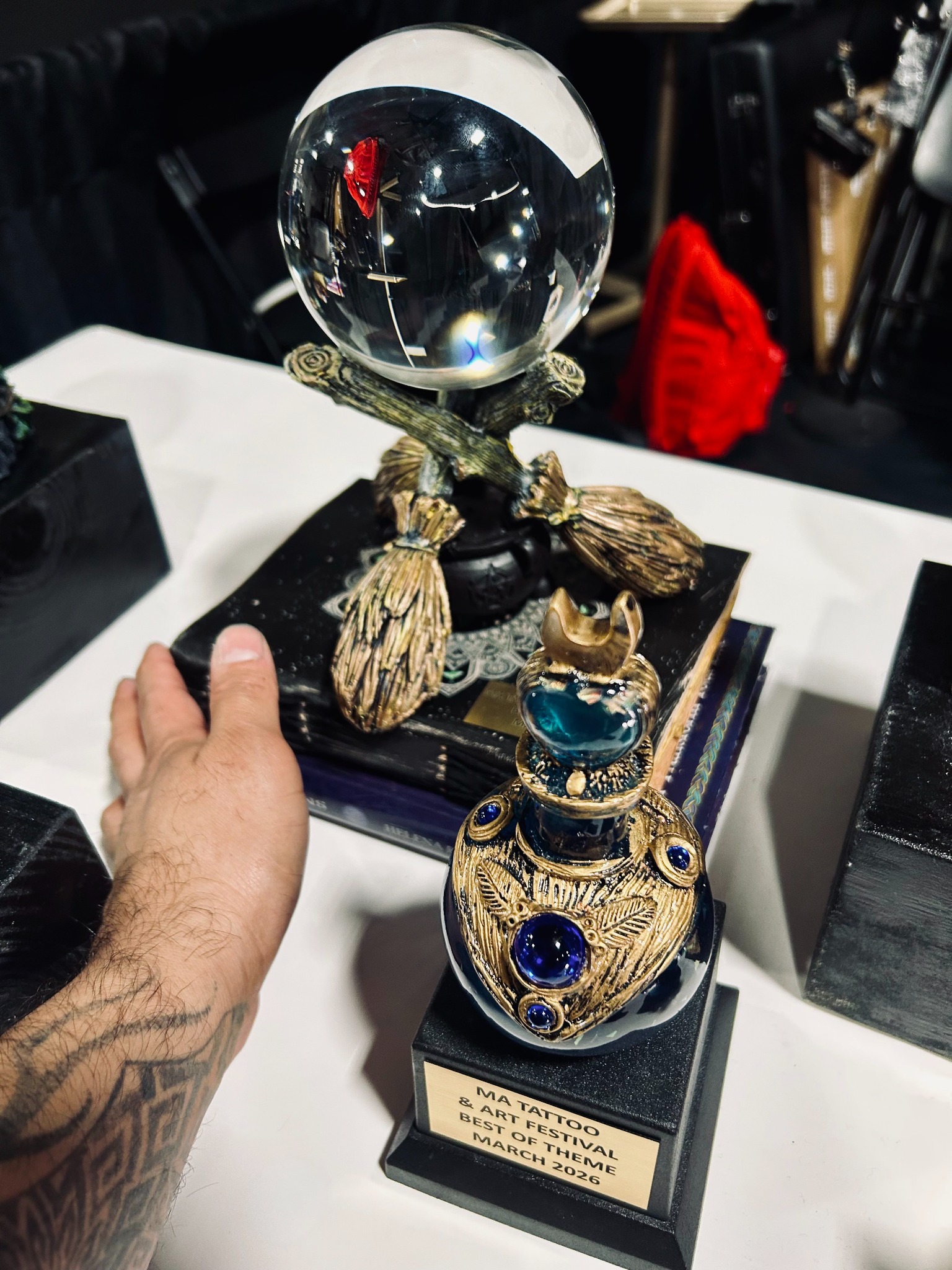 Close-up of MA Tattoo and Arts Festival Best of Theme award and trophy